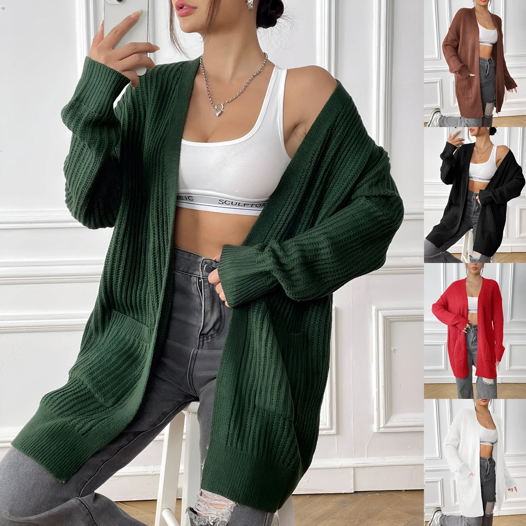 A dark green loose-fit women's cardigan sweater with two front pockets and long sleeves.