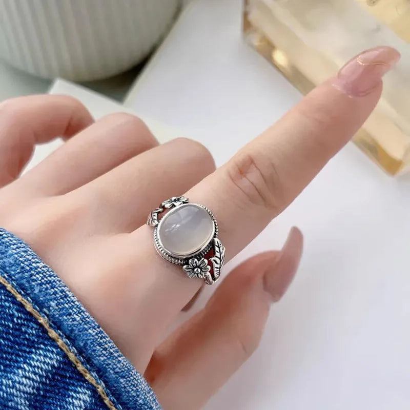 Copper vintage ring with white stone and adjustable U-shaped band.