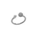 Golden open-end ring with round zircon stone on a white background.