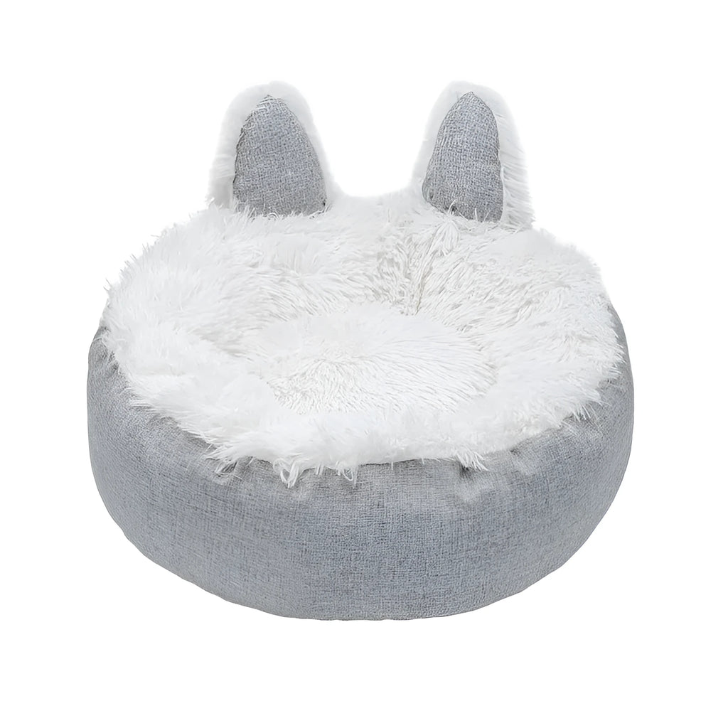 Round plush faux fur cat bed with raised sides in blue colour showing soft texture