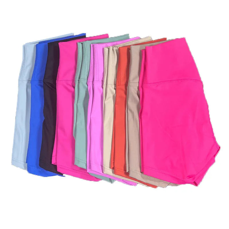 Women's high-waist yoga shorts in nylon fabric, shown in a colour selection including pink litchi and electric blue.