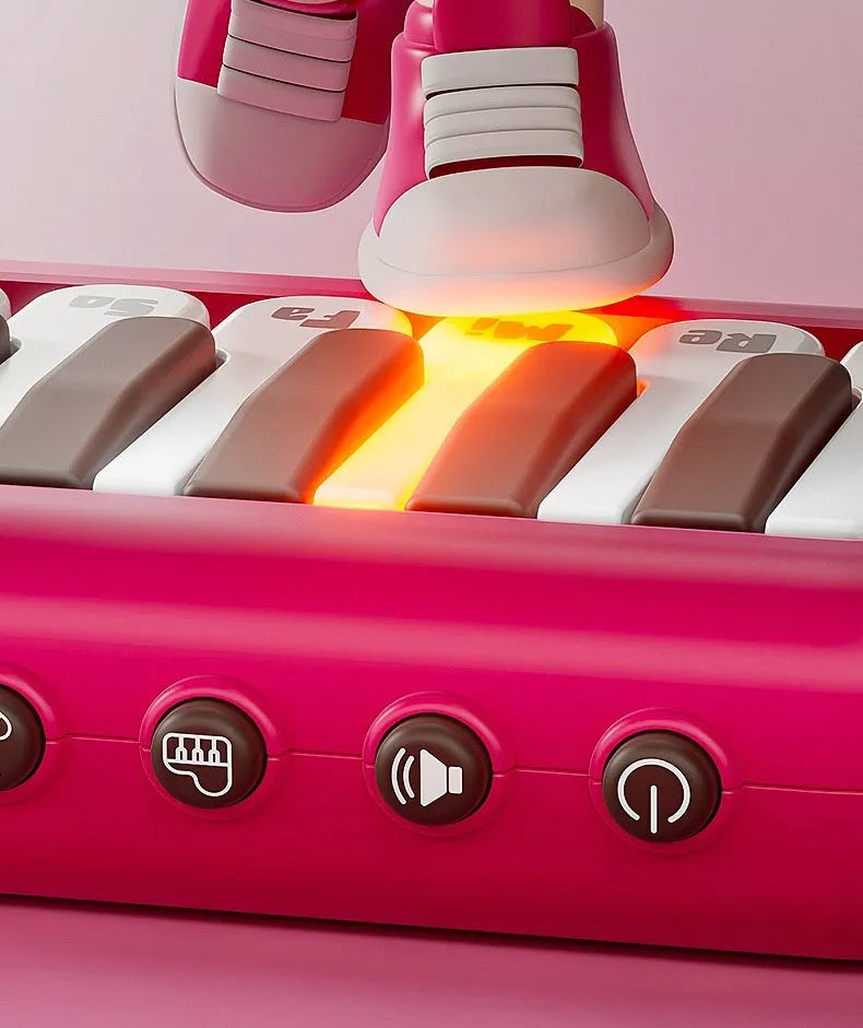 Baby pocket electronic keyboard toy in Little Piano Pattern design, shown in green and pink colour options.