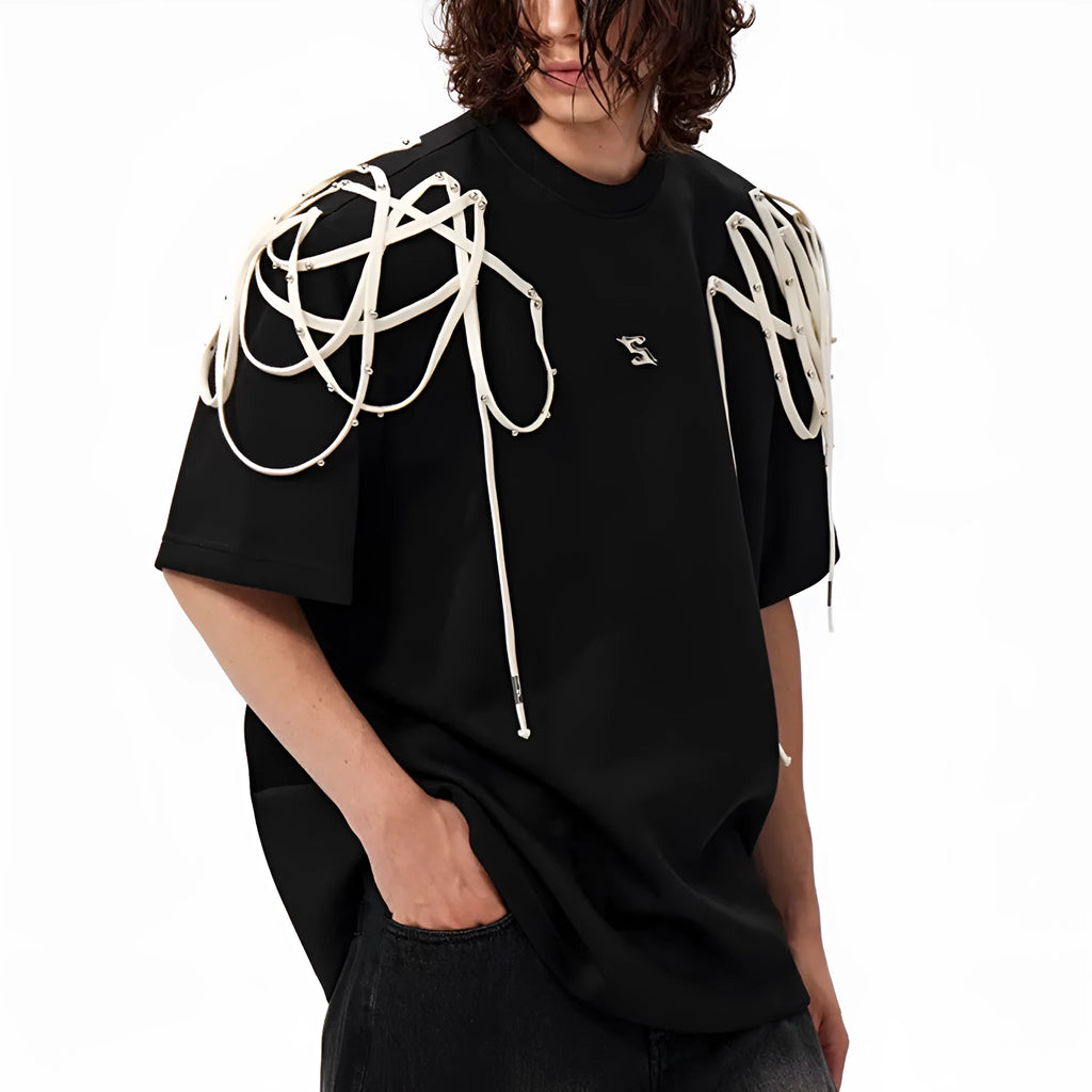 Black loose fit women's T-shirt with padded shoulders and decorative rivet ribbon detail.