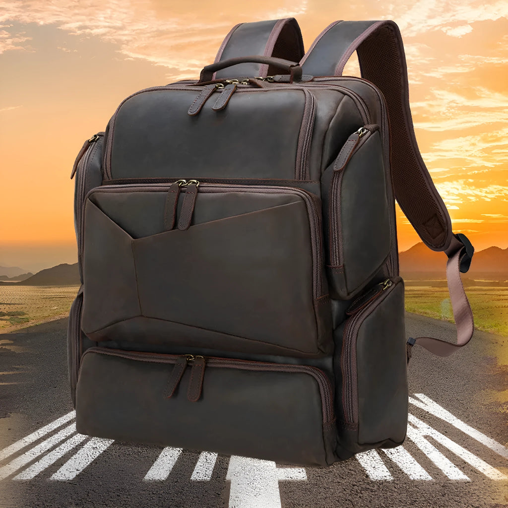 Dark brown genuine crazy horse leather backpack for men showing open pockets and organised internal compartments for a 17-inch laptop.