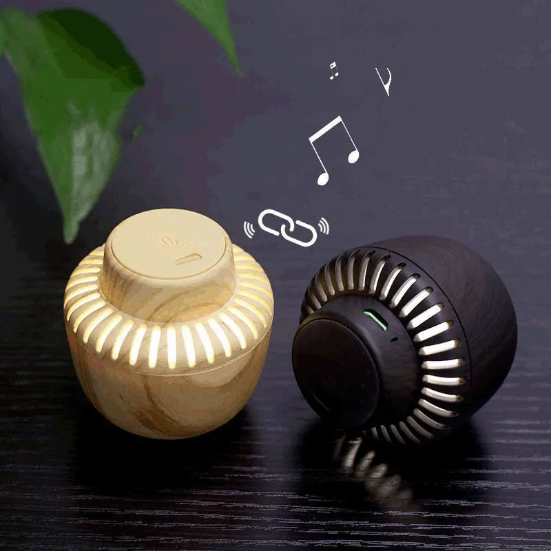 Portable mushroom-shaped Bluetooth speaker with LED night light, compact 55mm cube, in black colour
