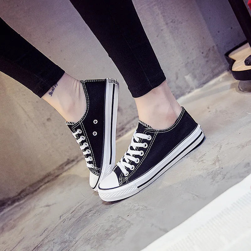 Women's solid colour canvas casual shoes in multiple colour options on a white background.