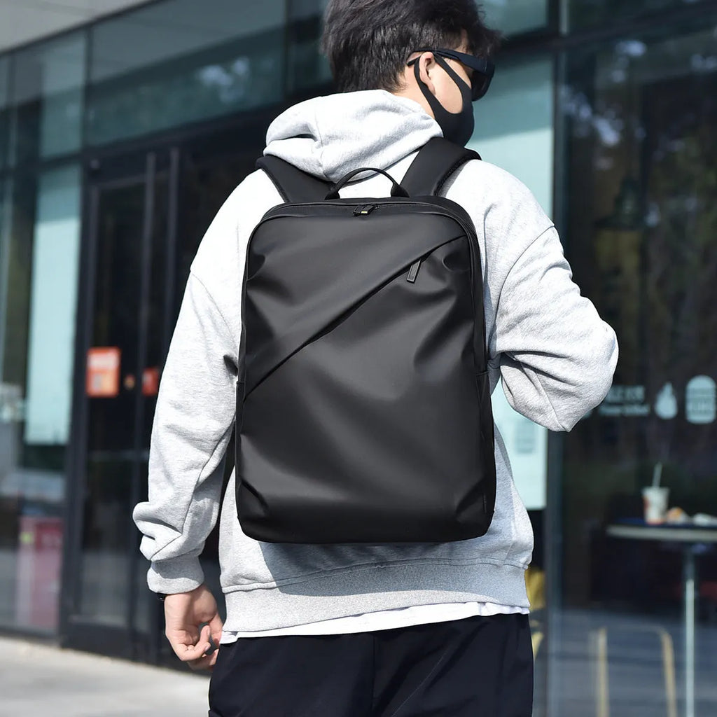 Men's waterproof PU leather backpack in black colour with computer compartment
