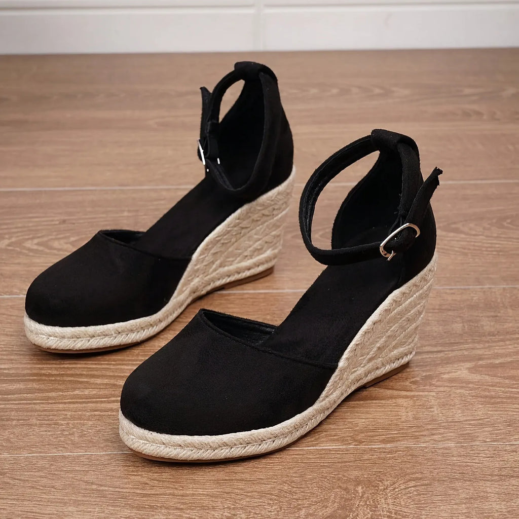 Women's apricot suede wedge sandals with an adjustable ankle buckle and rubber sole.