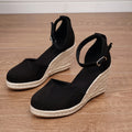Women's apricot suede wedge sandals with an adjustable ankle buckle and rubber sole.