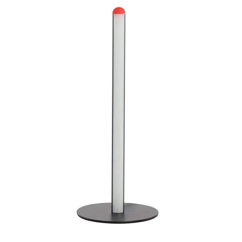 Vertical aluminium alloy floor lamp in modern simplicity style on a table.