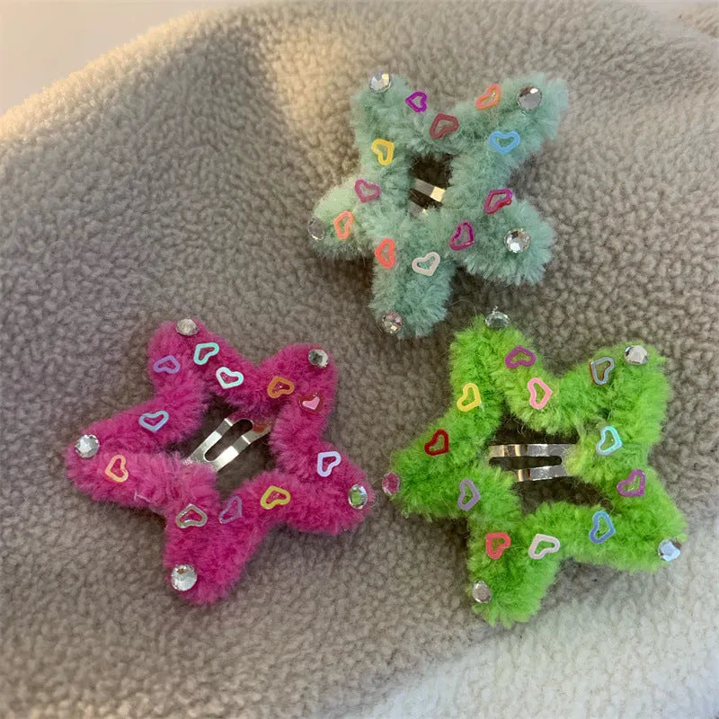 Plush hair clip with diamond star edge in pink, showing manual finish and side clip design