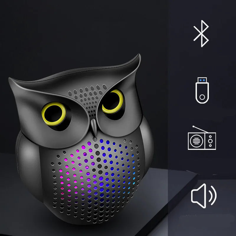 Black wireless Bluetooth speaker with a cartoon owl design on the front.