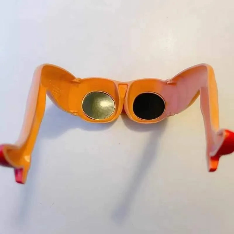 Orange plastic sunglasses with wide lenses on a white background, showing adjustable leg hip design.