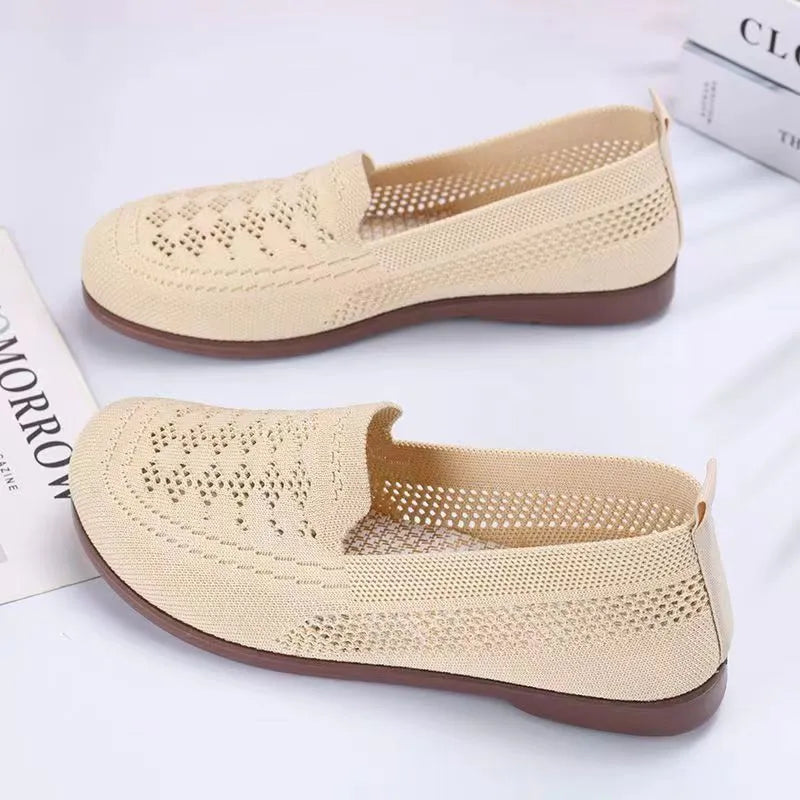 Women's beige low-top casual slip-on shoes with mesh upper and round toe.