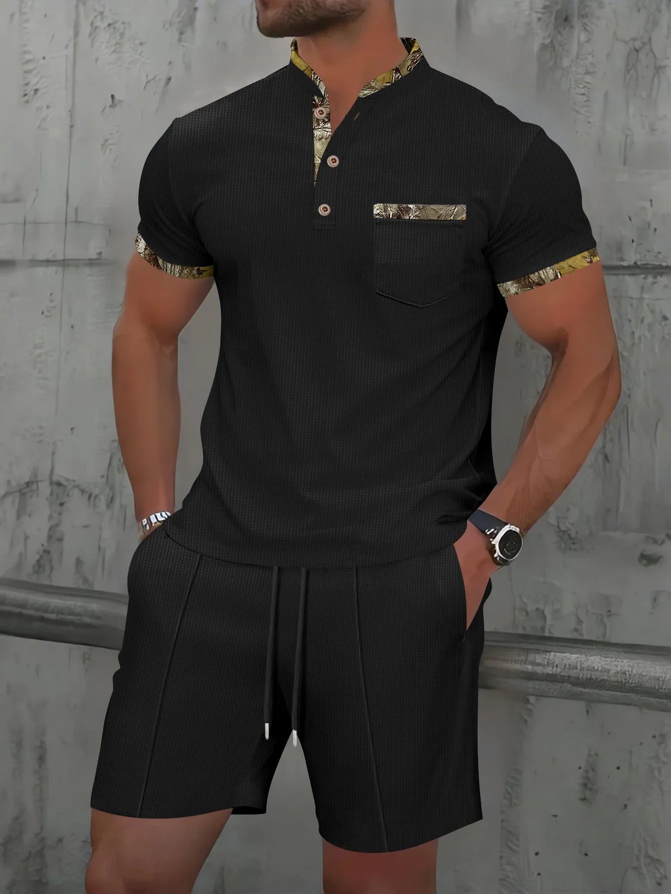 Men's grey zip-up polo collar short sleeve top and shorts tracksuit set laid flat.