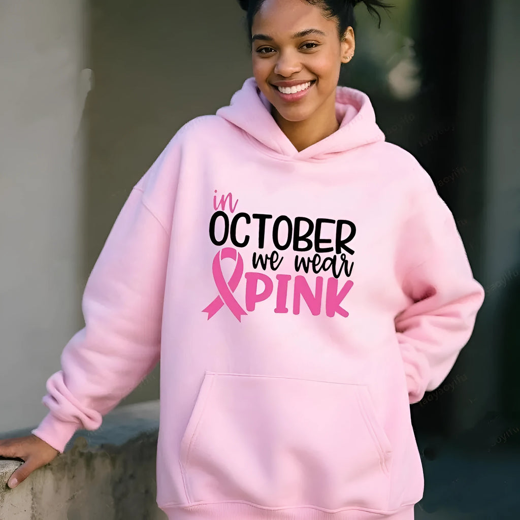 I'm A Survivor retro graphic hoodie in pink colour with side seam pockets, showing long-sleeve pullover design.