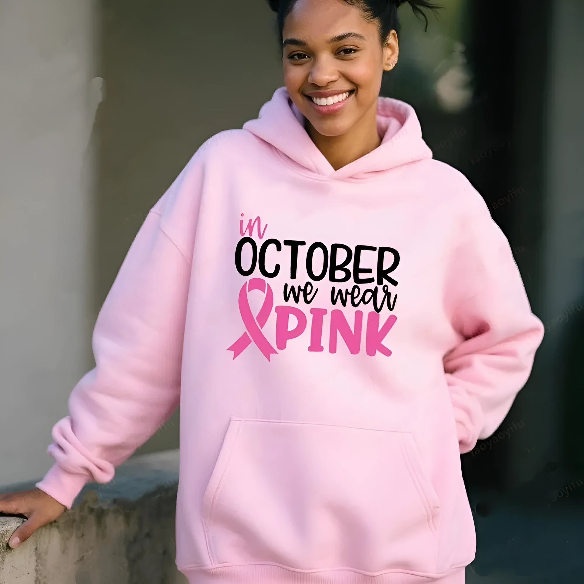 I'm A Survivor retro graphic hoodie in pink colour with side seam pockets, showing long-sleeve pullover design.