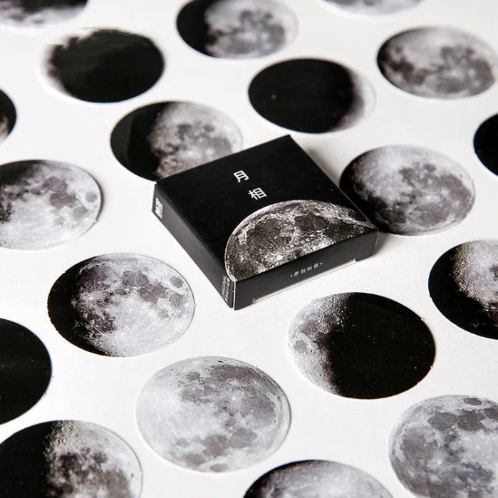 Boxed set of 45 black moon phase and calendar planet self-adhesive stickers.