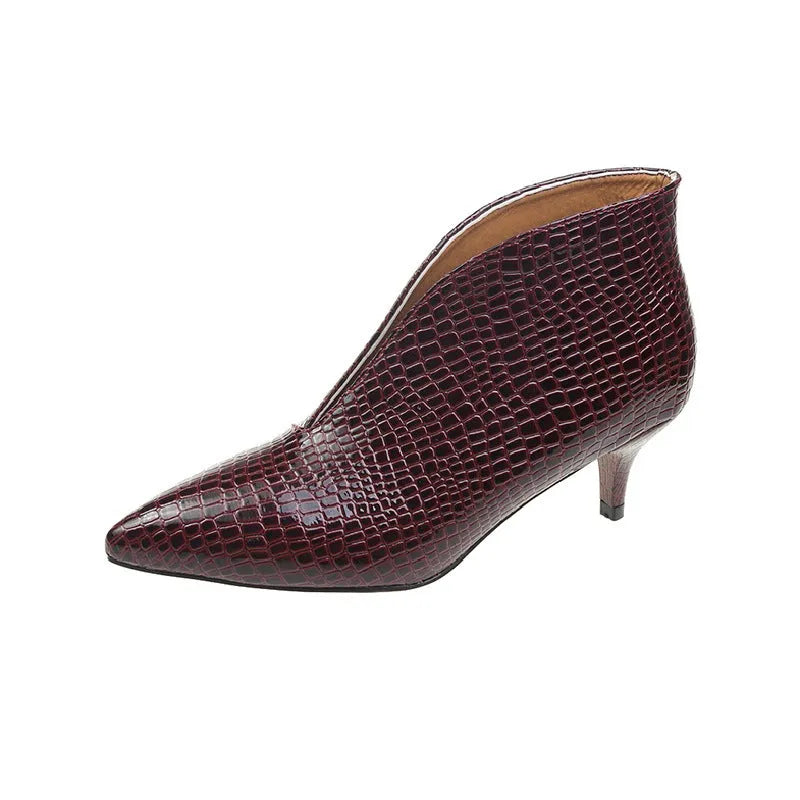 Women's black V cut pointed toe ankle boots with embossed detailing and chunky heel