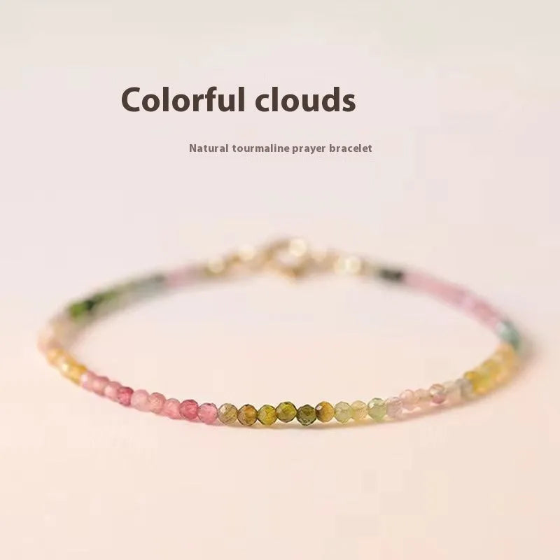 Handmade women's bracelet with geometric copper links and rainbow fluorite decoration