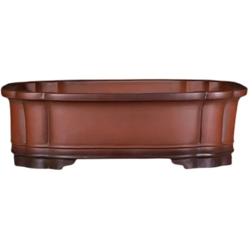 Large antique finish purple clay rectangular flowerpot with carved Chinese tree stump, pine, cypress, and fruit designs.
