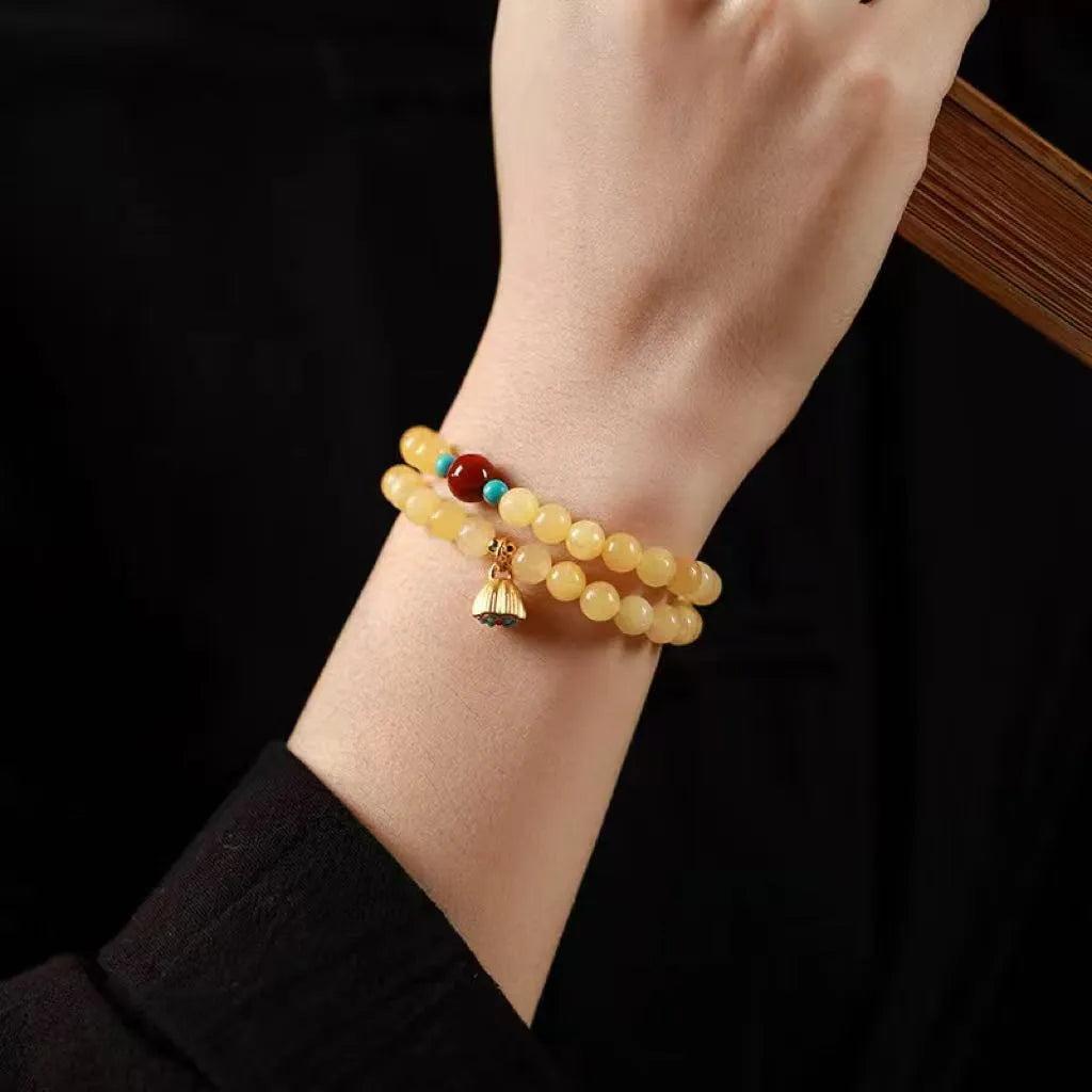 Handmade yellow jade topaz double ring bracelet with lotus seedpod design on 6mm or 8mm beads.