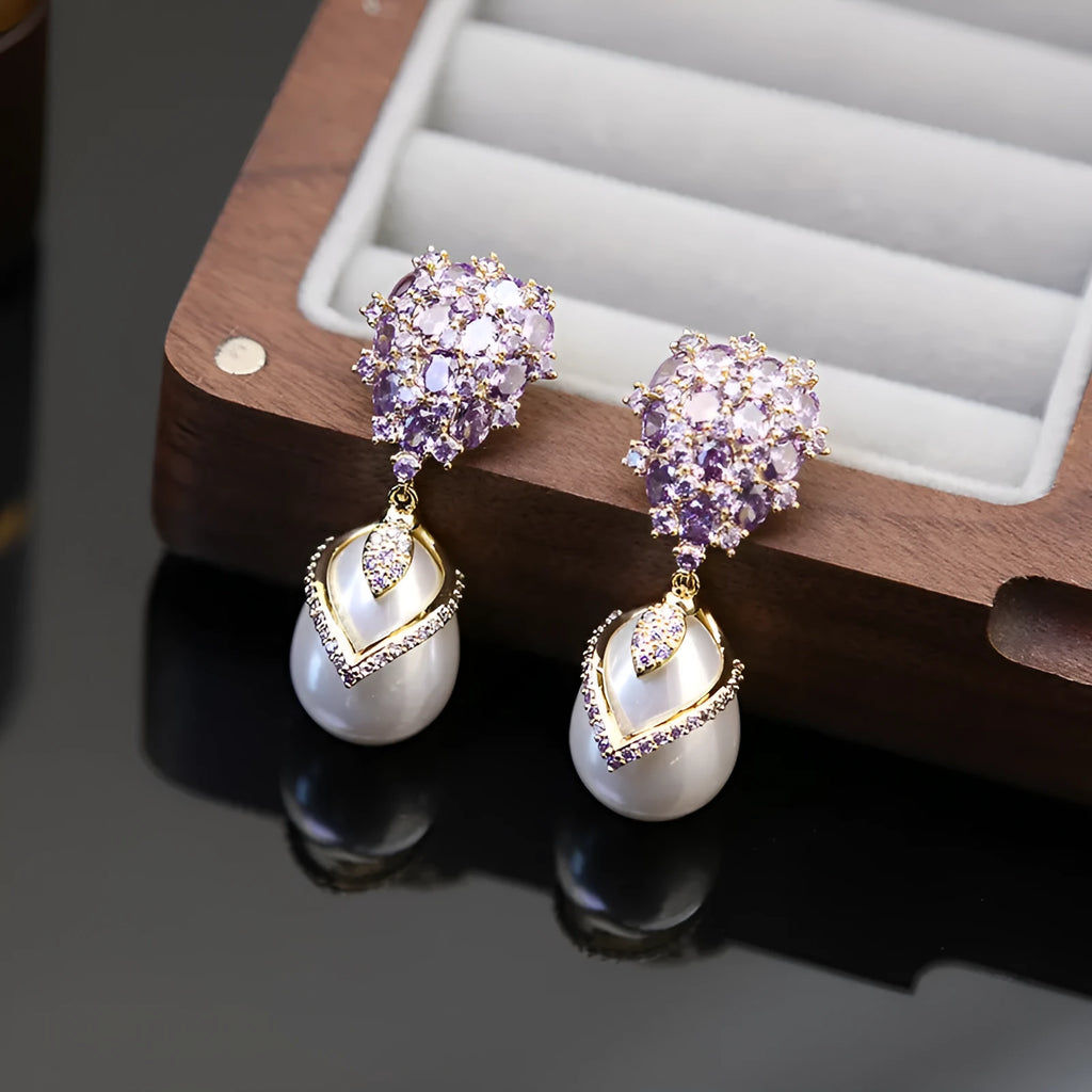 Women's drop-shaped pearl and zircon earrings with 18K gold plating in three colour variations.