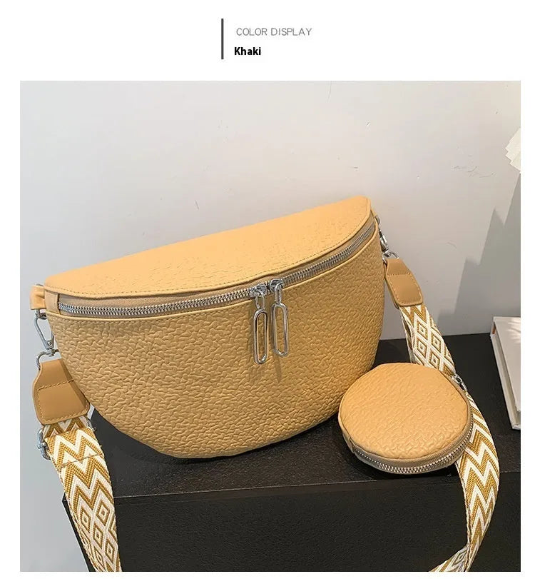 Women's PU leather crossbody bag with clamshell opening in solid colour with zipper texture details