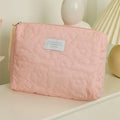 Quilted candy colour silk cosmetic bag for women showing pink, yellow, blue, white and green options