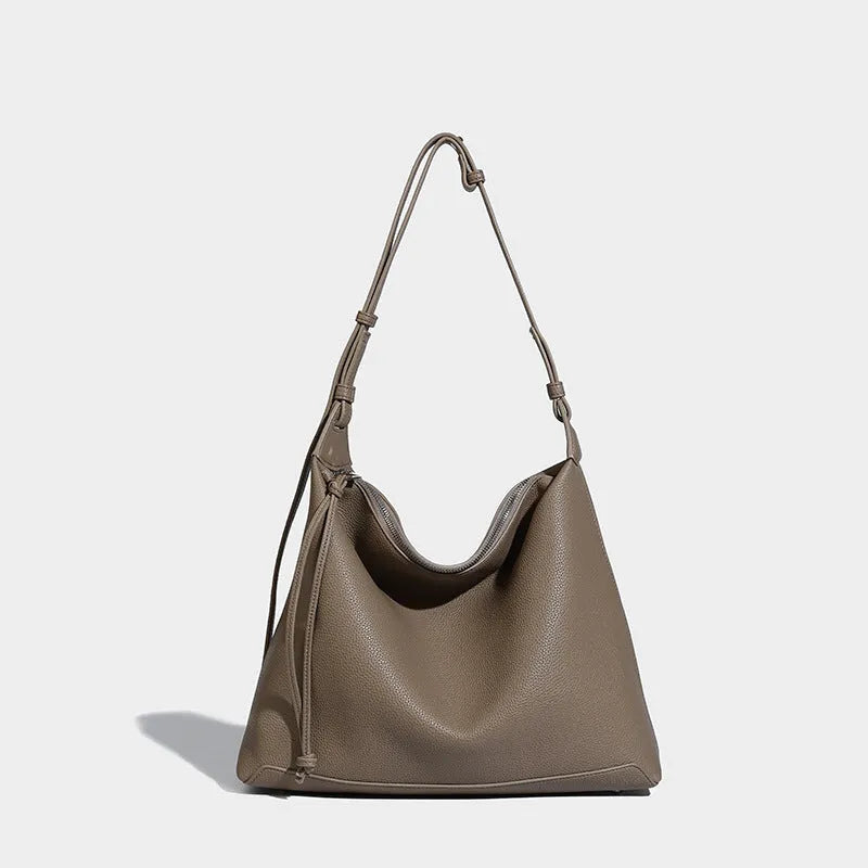 Large caramel coloured PU messenger bag with shoulder strap showing 36cm length