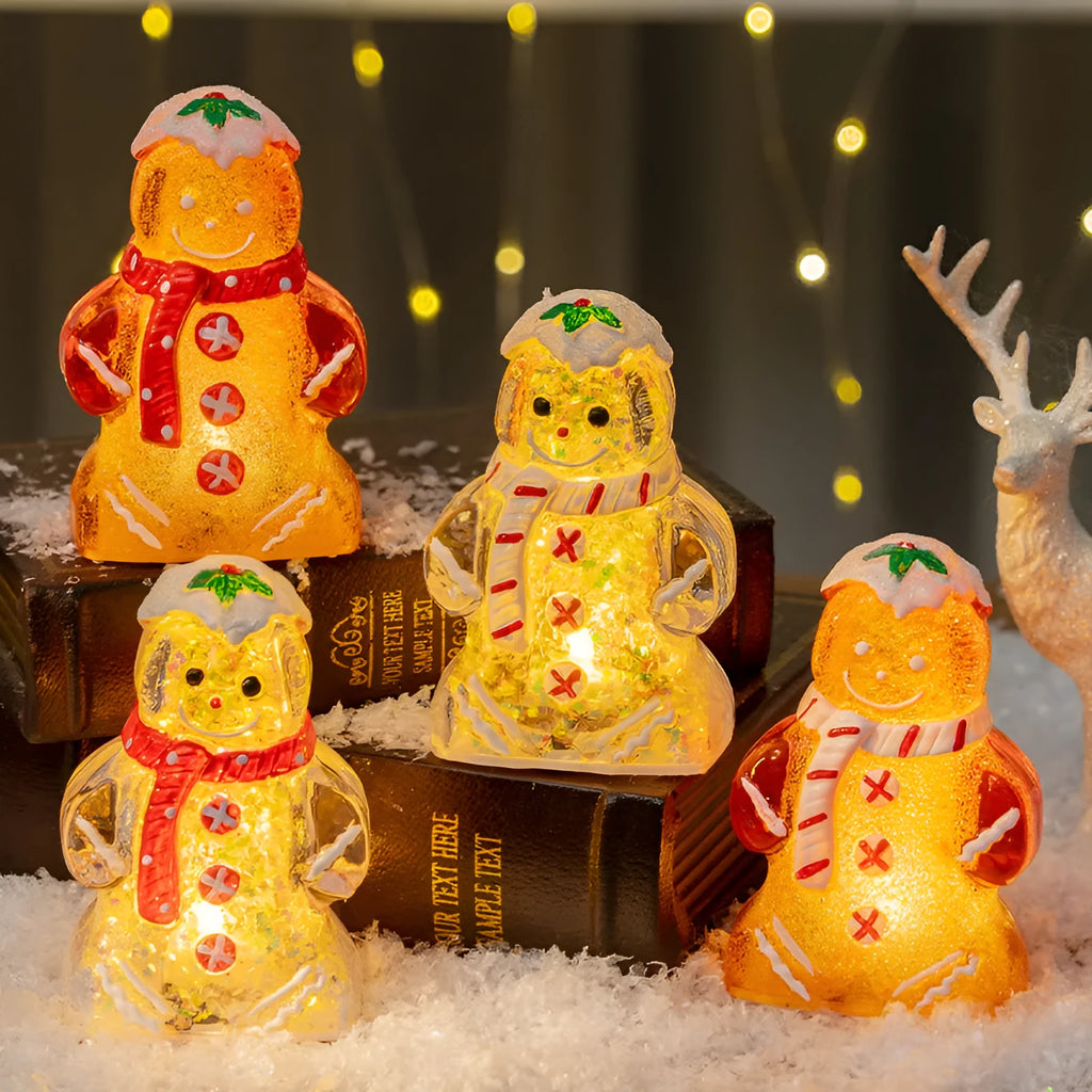 Glowing LED Christmas ornament of a gingerbread man with a red scarf.