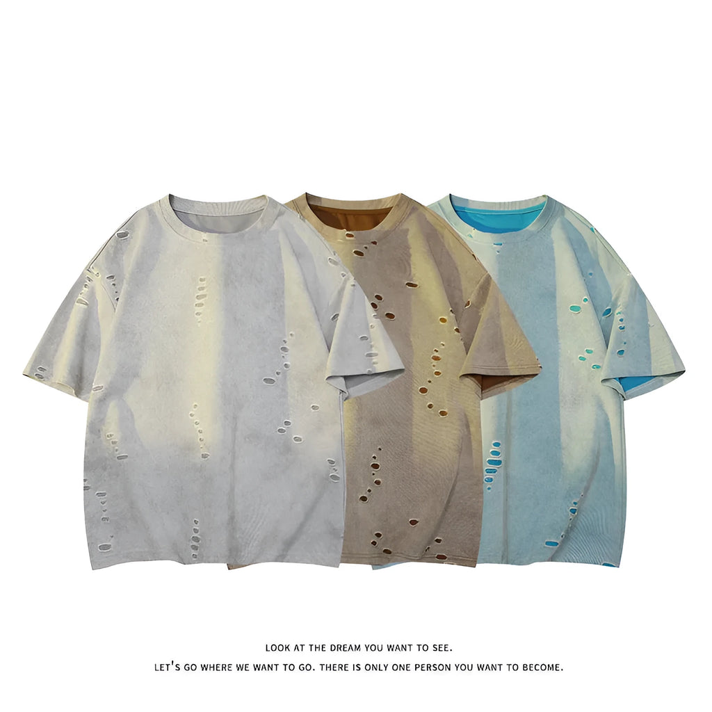Men's blue cotton blend ripped short sleeve t-shirt showing relaxed fit and distressed detailing