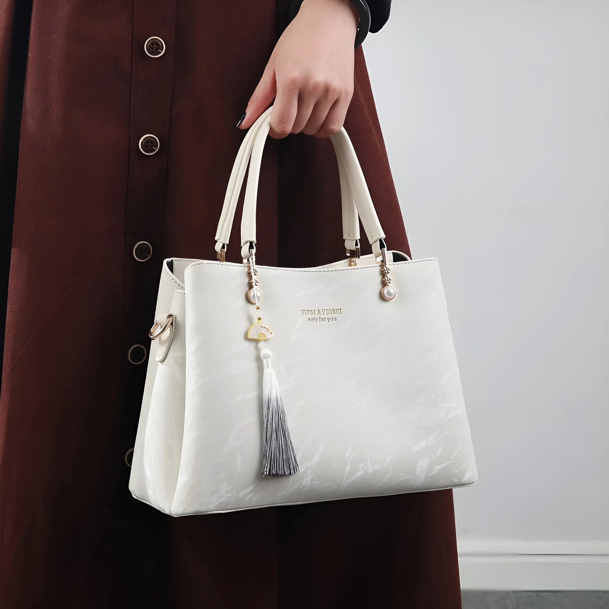 Women's large square shoulder bag in PU leather with a slit pocket, shown in beige colour.
