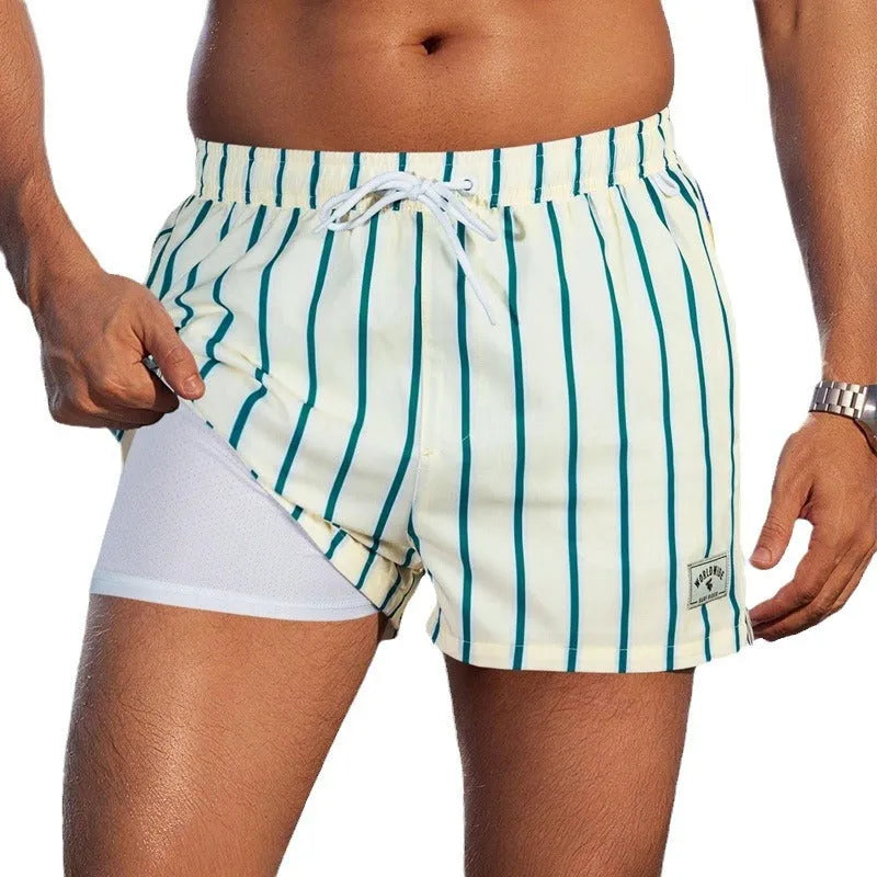 Men's loose green boxer-style swimming trunks made from elastic spandex fabric.