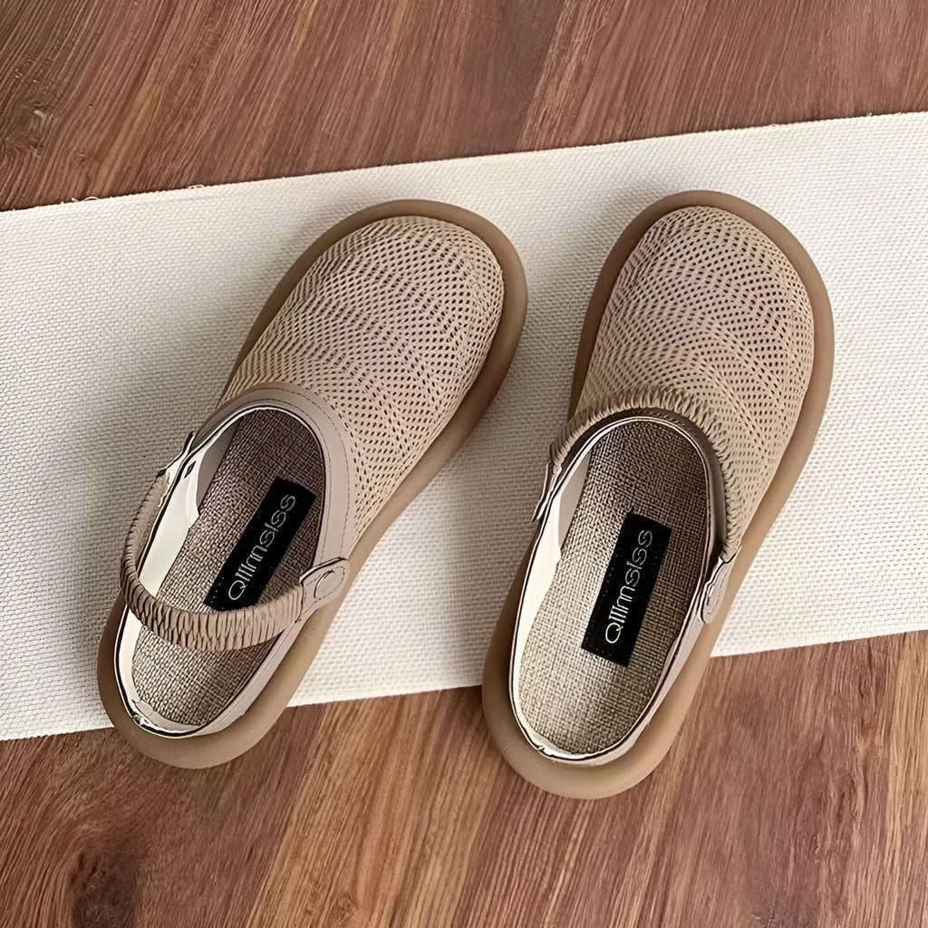 Women's beige linen slip-on shoes with mesh lining, round toe, and rubber sole on a neutral background.