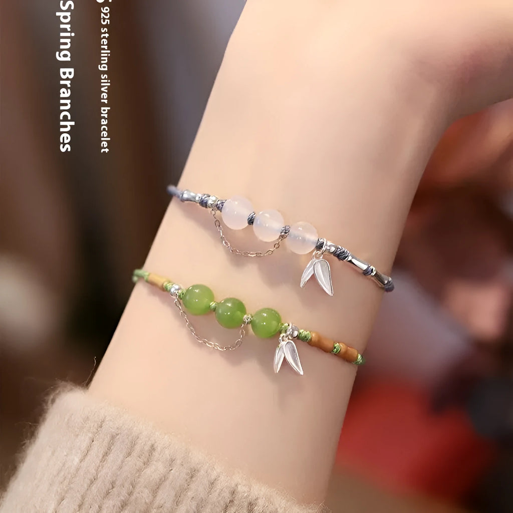 Hetian jade diamond-shaped bracelet with lotus seedpod design and woven carrying strap in light green or haze blue colour options