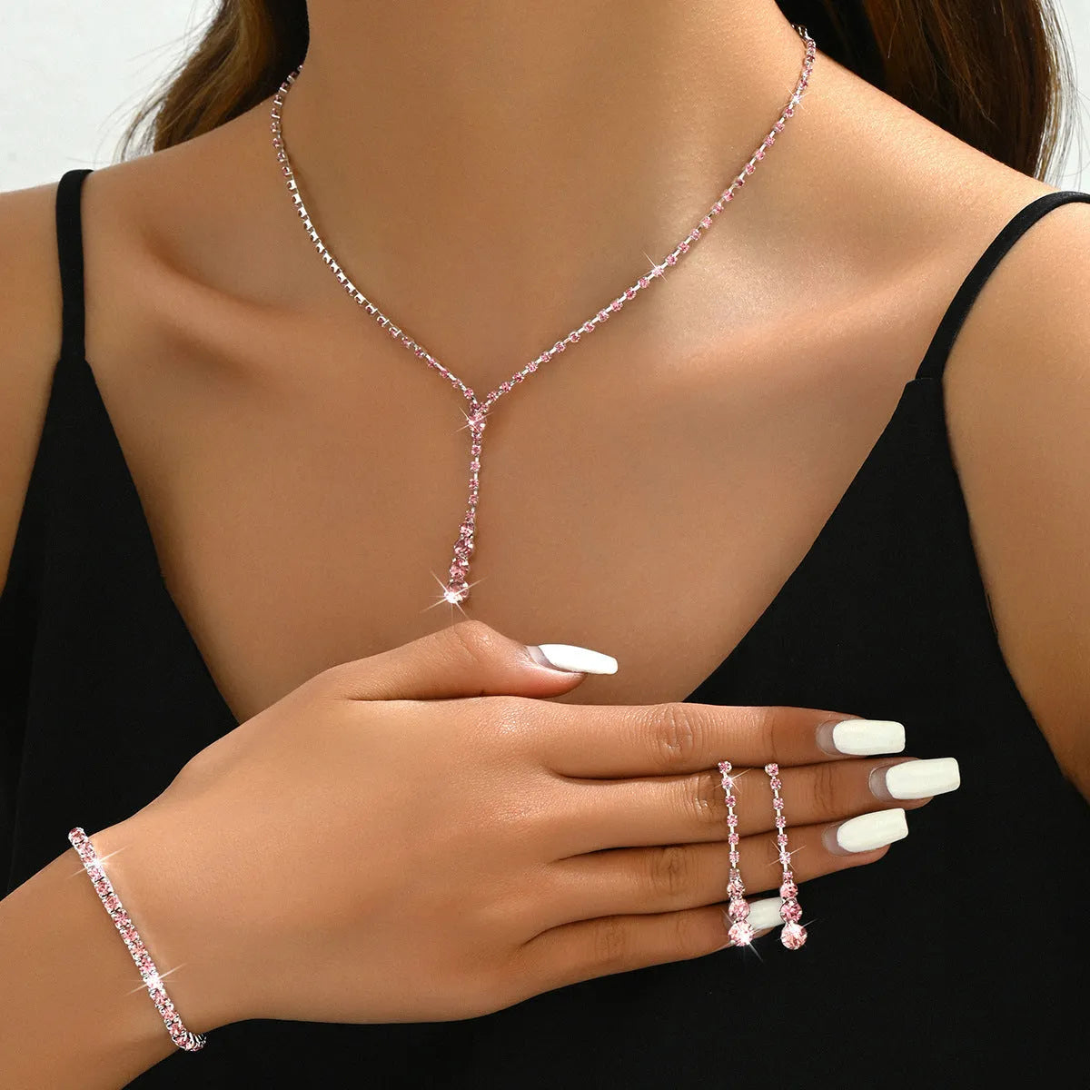 Rhinestone wedding jewellery three-piece set with necklace, bracelet and earrings on snake bone chain