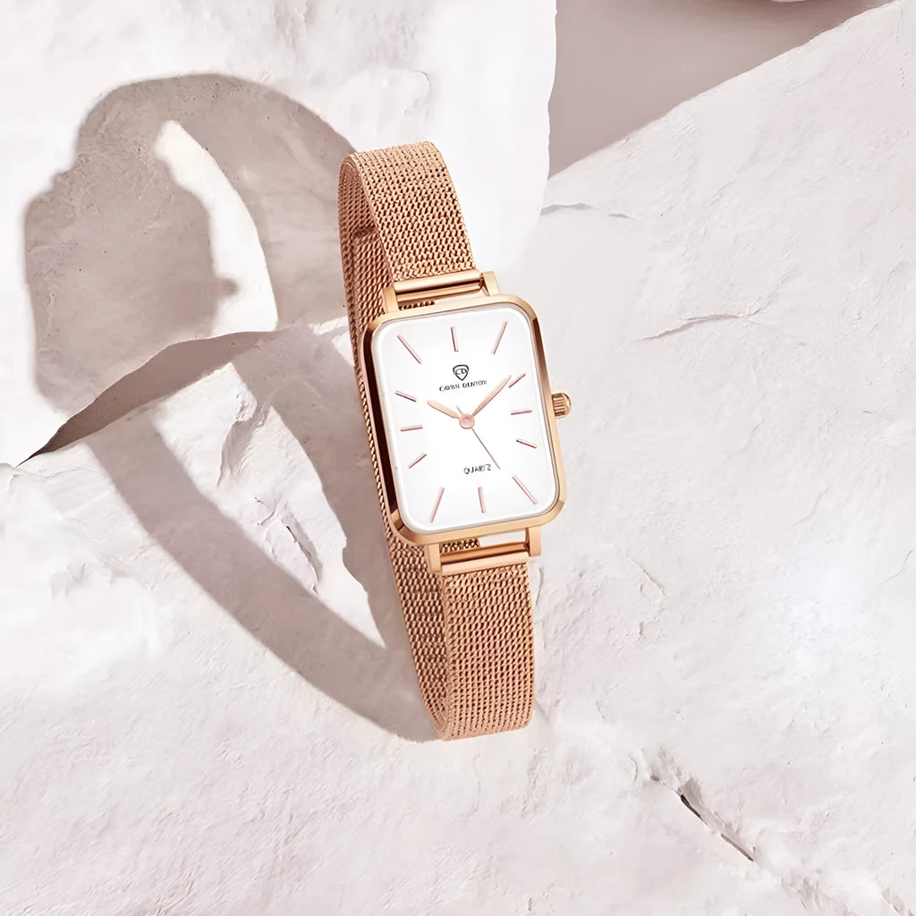 Women's rose gold waterproof quartz watch with woven steel strap and alloy case.