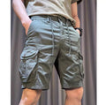 Loose straight-leg khaki overalls trousers with elastic waist and front slash pockets on a neutral background