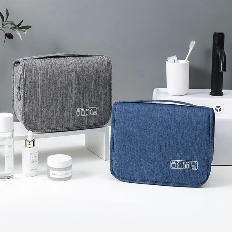 Cube-shaped cationic hanging toiletry bag in gray with metal hook, matte finish, and dry-wet separation compartments