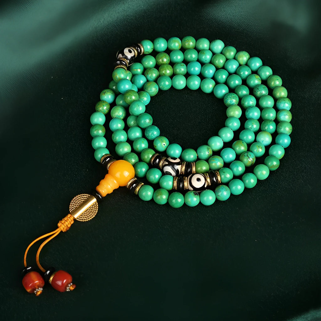 Natural turquoise bracelet with 108 polished 8mm round beads on white background