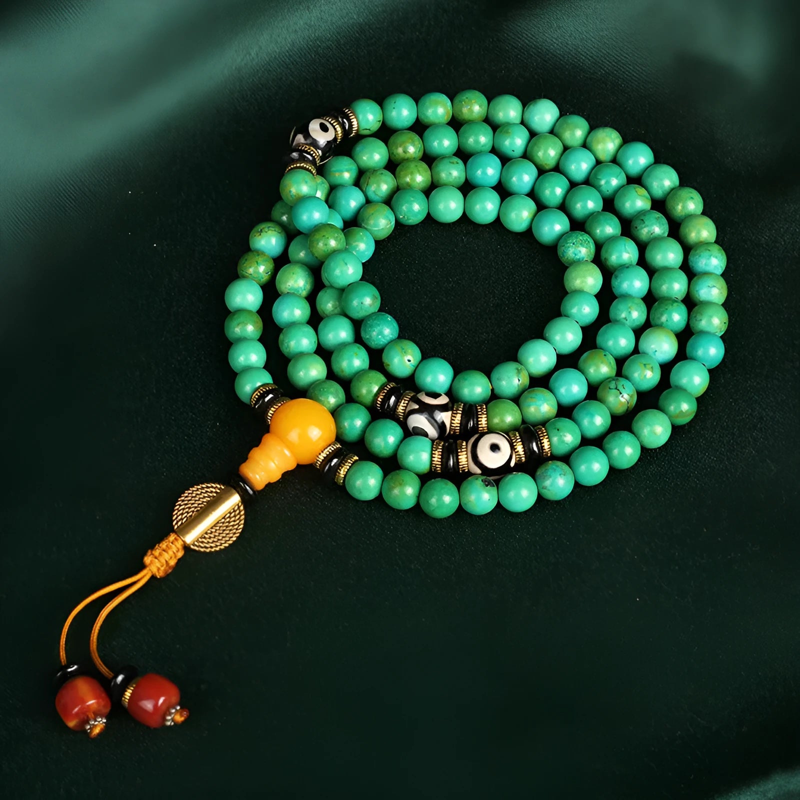 Natural turquoise bracelet with 108 polished 8mm round beads on white background