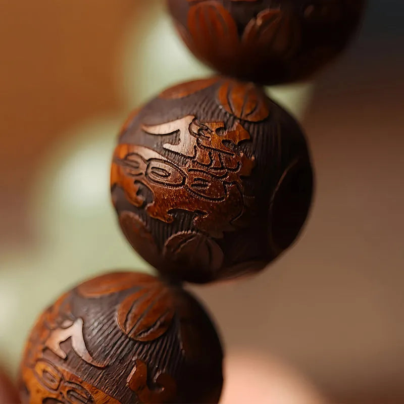 Rosewood flexible bracelet with fu character carving showing 20mm rings and amass fortunes colour finish