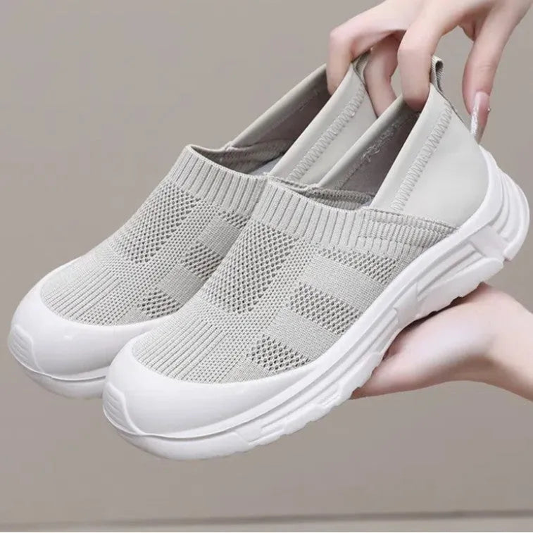 Women's black slip-on shoes with round toe design and soft PVC sole for casual wear