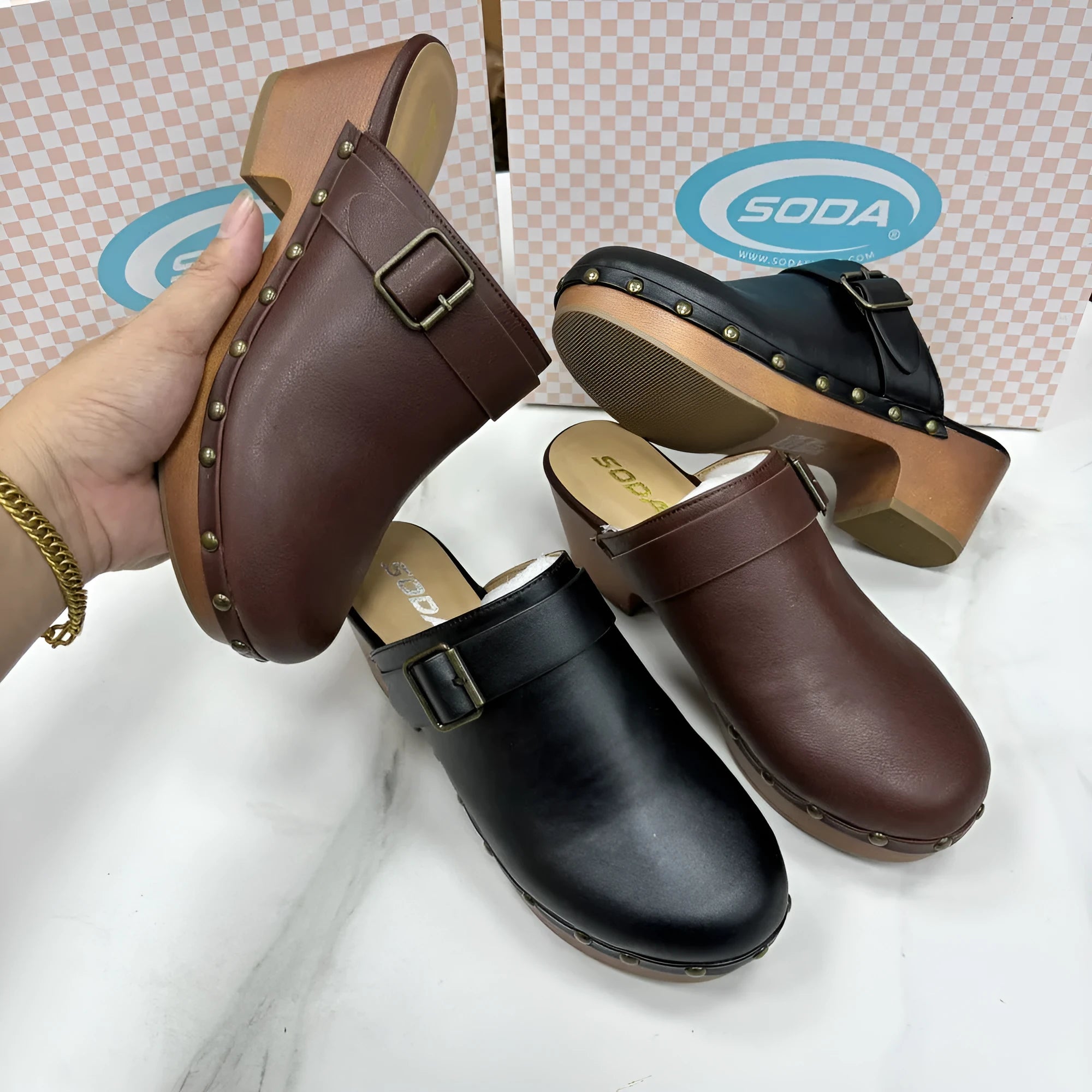 Black retro chunky heel slippers with closed toe, rivet details, and a rubber sole.