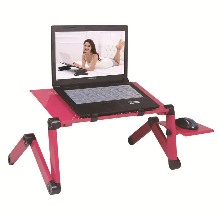 Red folding metal computer desk in use with a laptop, showing its cooling fans and optional mouse board extension.