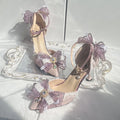 Purple women's flat wedding shoes with satin upper, flower decoration, and a square toe.