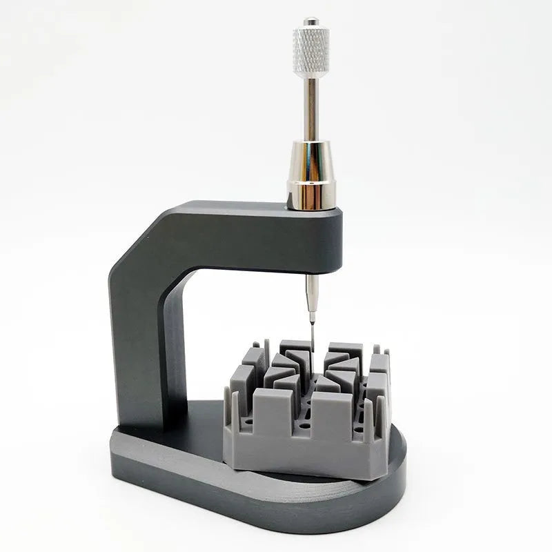 Silver multi-purpose press strap removal tool with a tool steel blade for watch and jewellery repair.