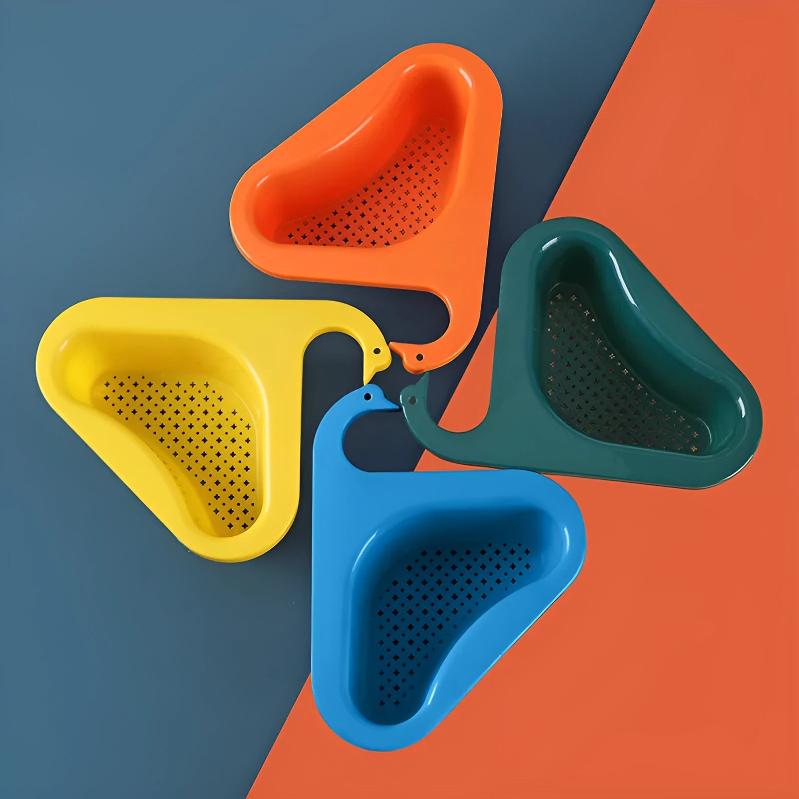 Blue plastic swan-shaped basket hanging over a kitchen sink edge to drain fruit and vegetables.