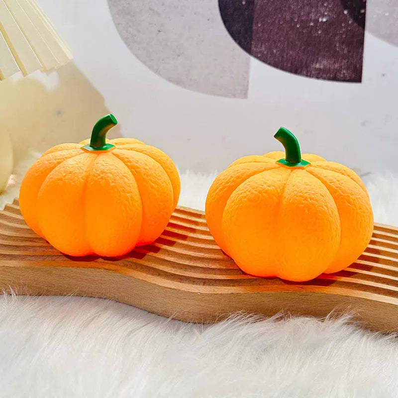 Pumpkin-shaped rechargeable decorative night light on a bedside table, 10.3 x 8 cm